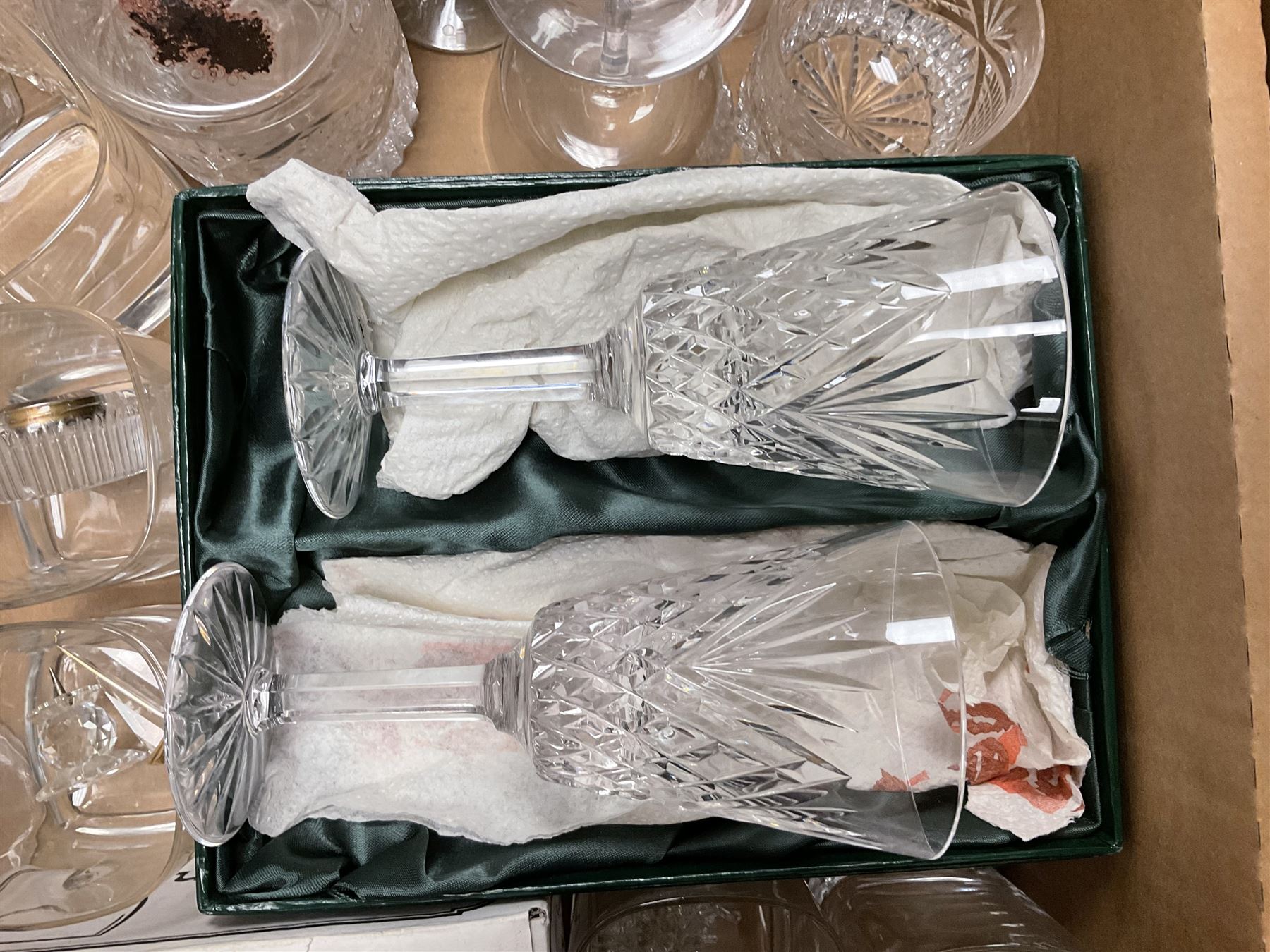 Caithness 'Fireball' paperweight, together with four cased Tyrone Crystal glasses, glass oil lamp, three glass decanters etc, in two boxes