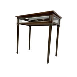 Walnut and brass inlaid bijouterie cabinet, the rectangular lid with bevelled glass pane inlaid with brass stringing, velvet lined interior, on tapering turned and fluted supports with brass collars and feet
