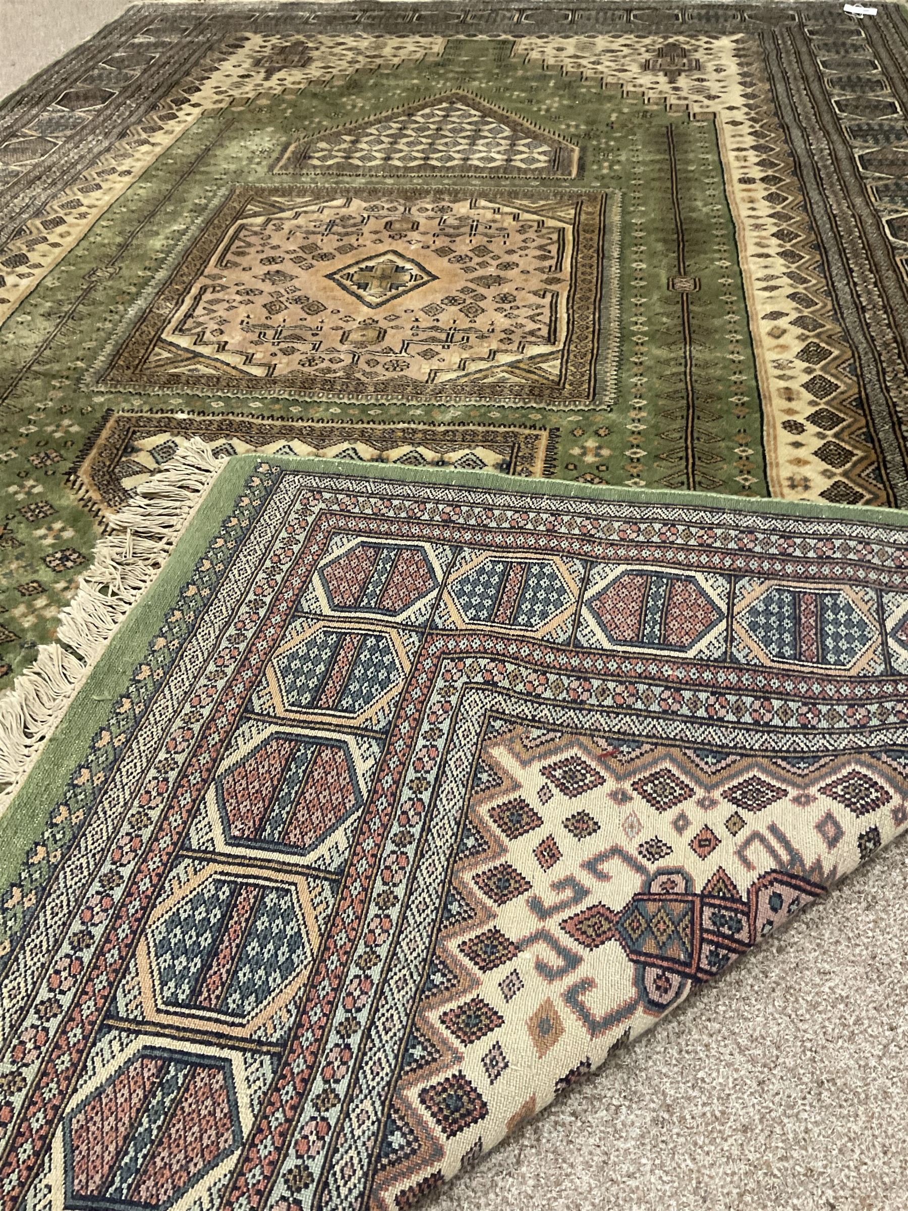 Persian design green and beige ground carpet, the field decorated with