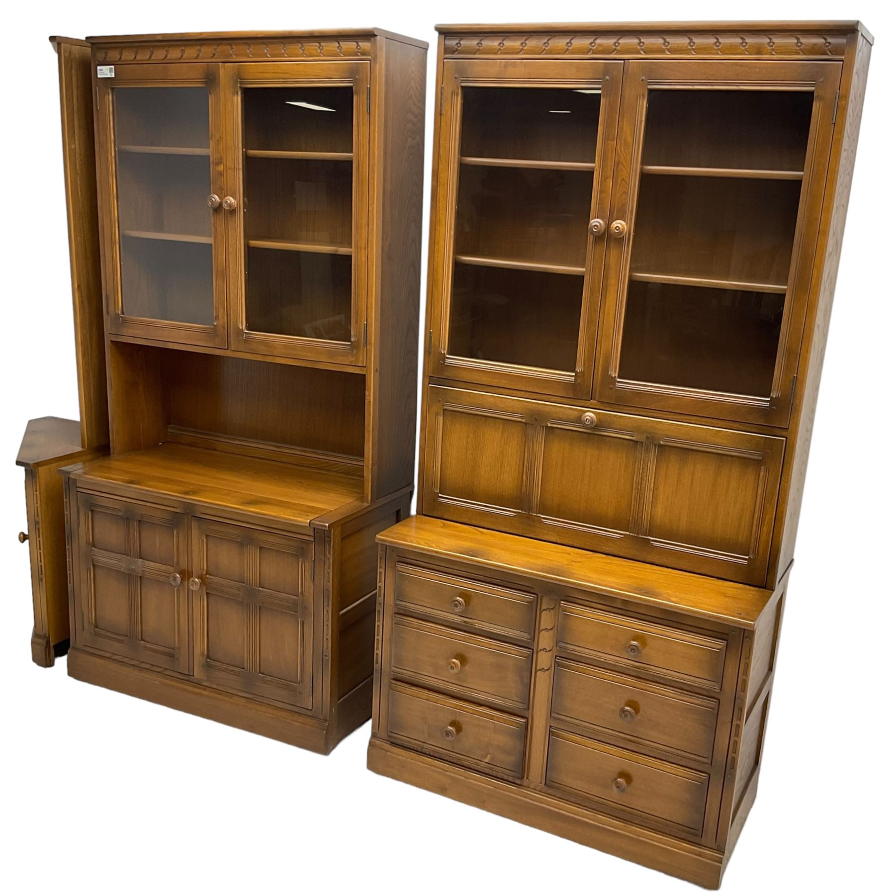 Ercol - mid-20th century dark elm 'Old Colonial' three sectional wall display unit, comprising two units and corner unit, fitted with open shelves, glazed cupboards and drawers