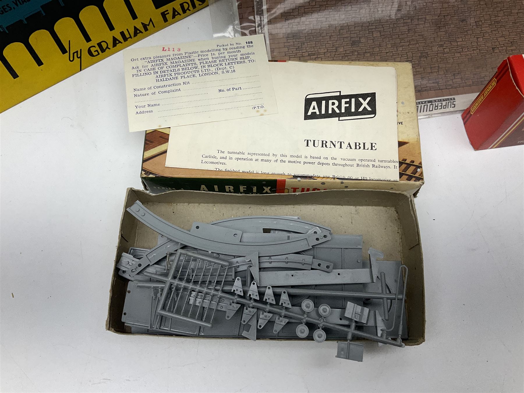 '00' gauge trackside accessories including Metcalfe kits for Platform, Goods Shed and Signal box, Superquick locomotive shed, Airfix kits for locomotive, wagons and buildings etc, Dapol Station Accessories and Turntable, six Parkside Dundas wagon kits, Hornby Footbridge etc; most boxed or packaged
