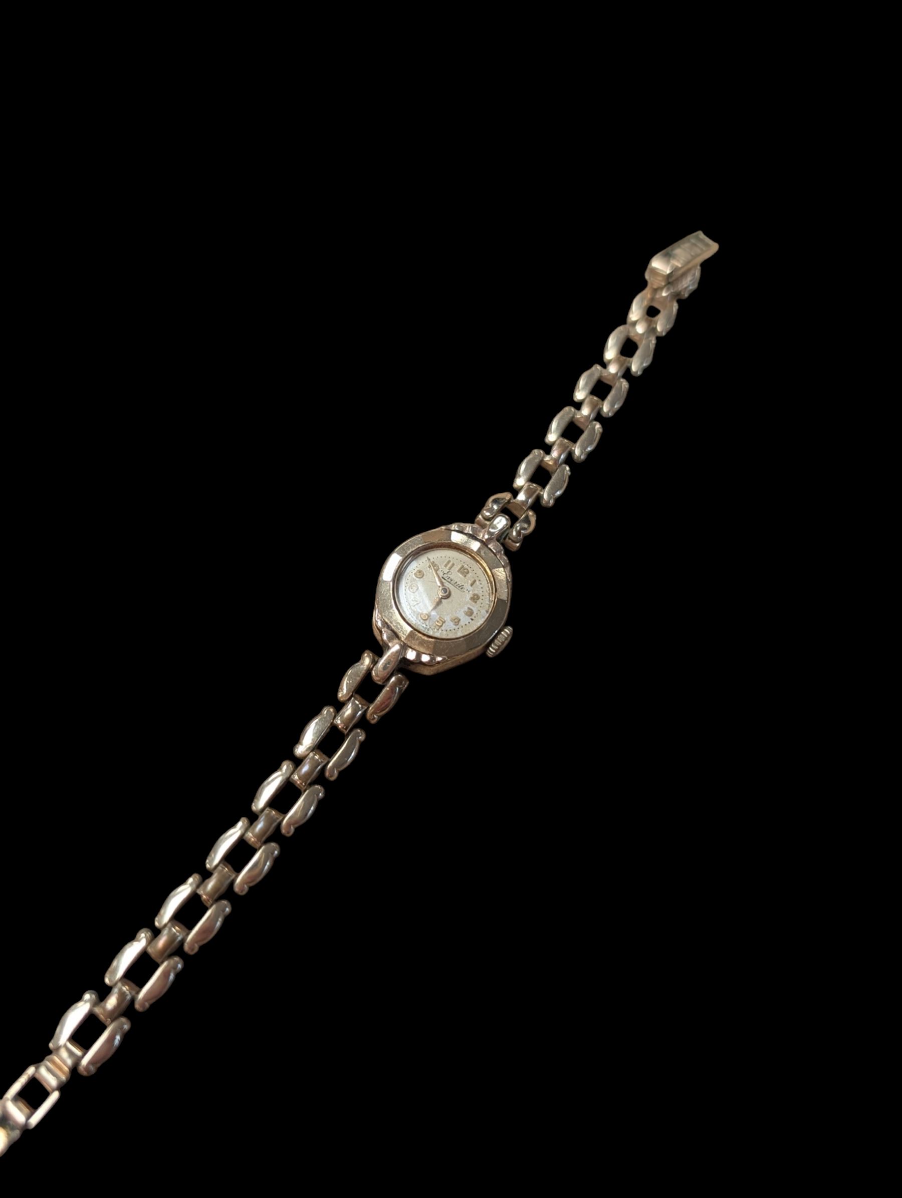 9ct gold cased Everite ladies manual wind wriswatch, on rolled gold bracelet