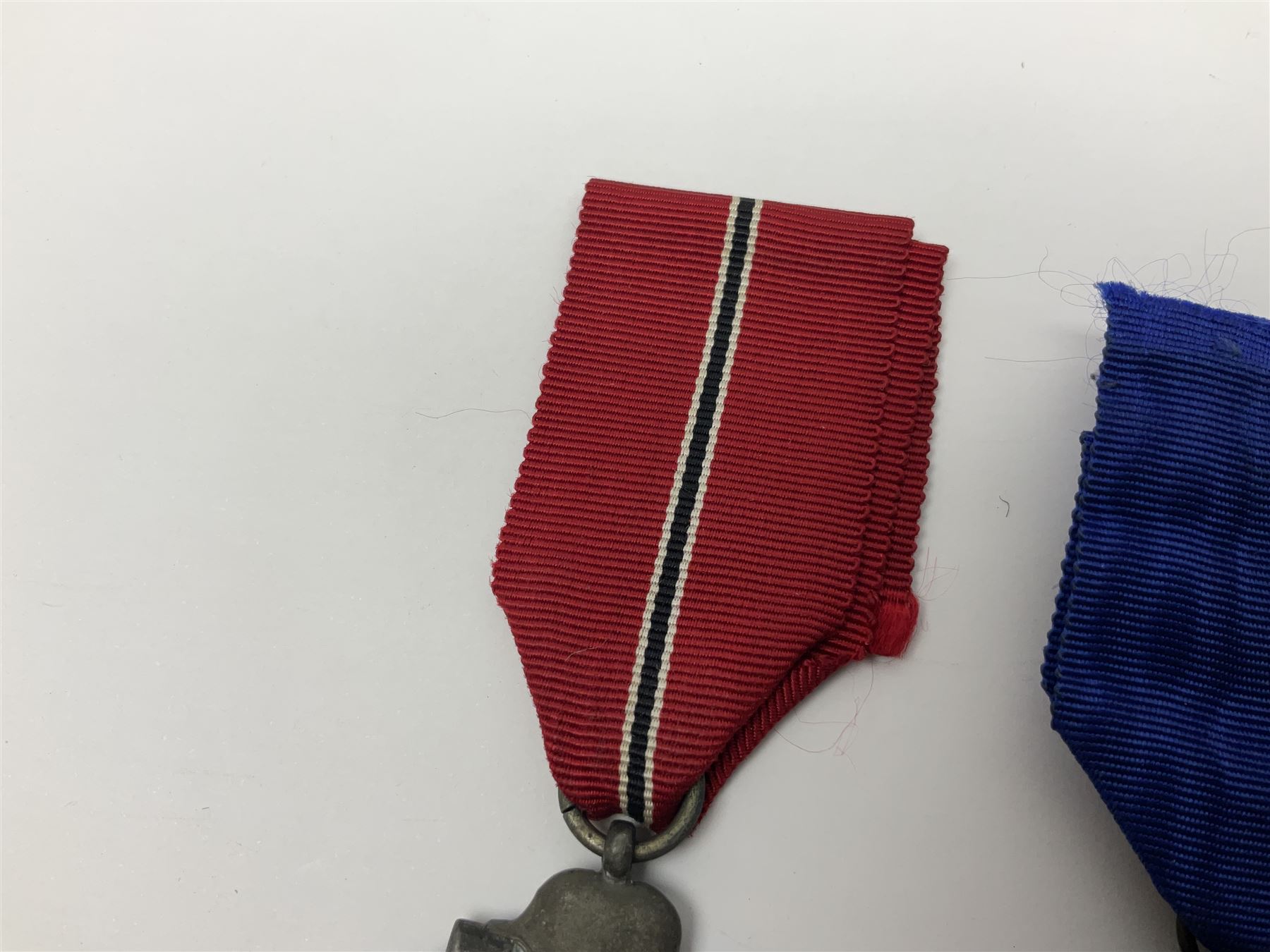 WWII German 'SS' Long Service Medal for four years; Ostfront Medal for the Winter Campaign in Russia of 1941-1942 'Die Medaille Winterschlacht Im Osten'; and War Merit Cross 2nd Class with swords; all with ribbons (3)