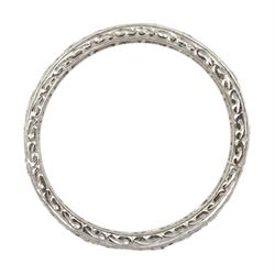 Early-mid 20th century platinum channel set diamond full eternity ring, the band with engraved decoration, total diamond weight approx 0.90 carat