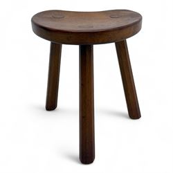 Mouseman - oak three-legged calf stool, kidney-shaped seat carved with the signature mouse motif, by the workshop of Robert Thompson, Kilburn