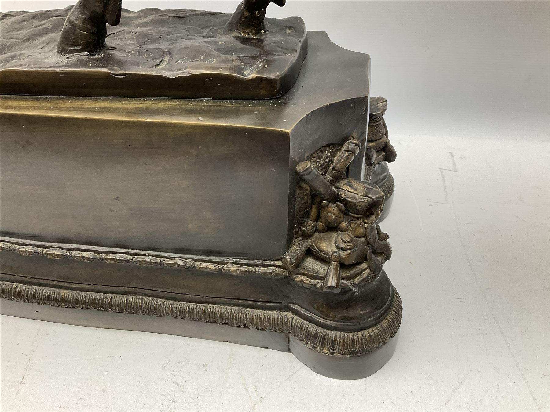 Large and impressive bronze figure of Wellington seated on a horse, on a sarcophogus shaped stepped base impressed 'Meunier Paris', the canted corners inset with battle trophies H68cm L50cm D22cm