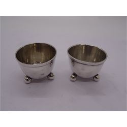 Set of four Victorian silver open salts, of cauldron form upon tripod feet, hallmarked Mappin & Webb, London 1891, together with a further pair of Victorian silver open saults, of similar form upon three ball feet, hallmarked Birmingham 1887, probably Horace Woodward & Co, approximate total weight 2.52 ozt (78.4 grams)