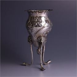 Late Victorian silver vase, of baluster form with fluted rim, the body with embossed floral decoration, upon three tall legs with ramshead mounts, hallmarked William Comyns & Sons, London 1890, H13.5cm