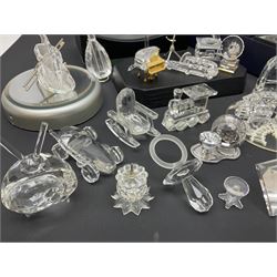Large collection of Swarovski Crystal, to include pineapple, grapes, ships, musical instalments, Father Christmas, etc, together with stands  