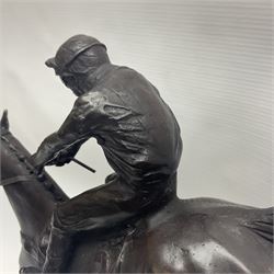 Bronze, modelled as racehorse and jockey jumping a hurdle, on a naturalistic base and shaped black marble plinth, overall H32cm