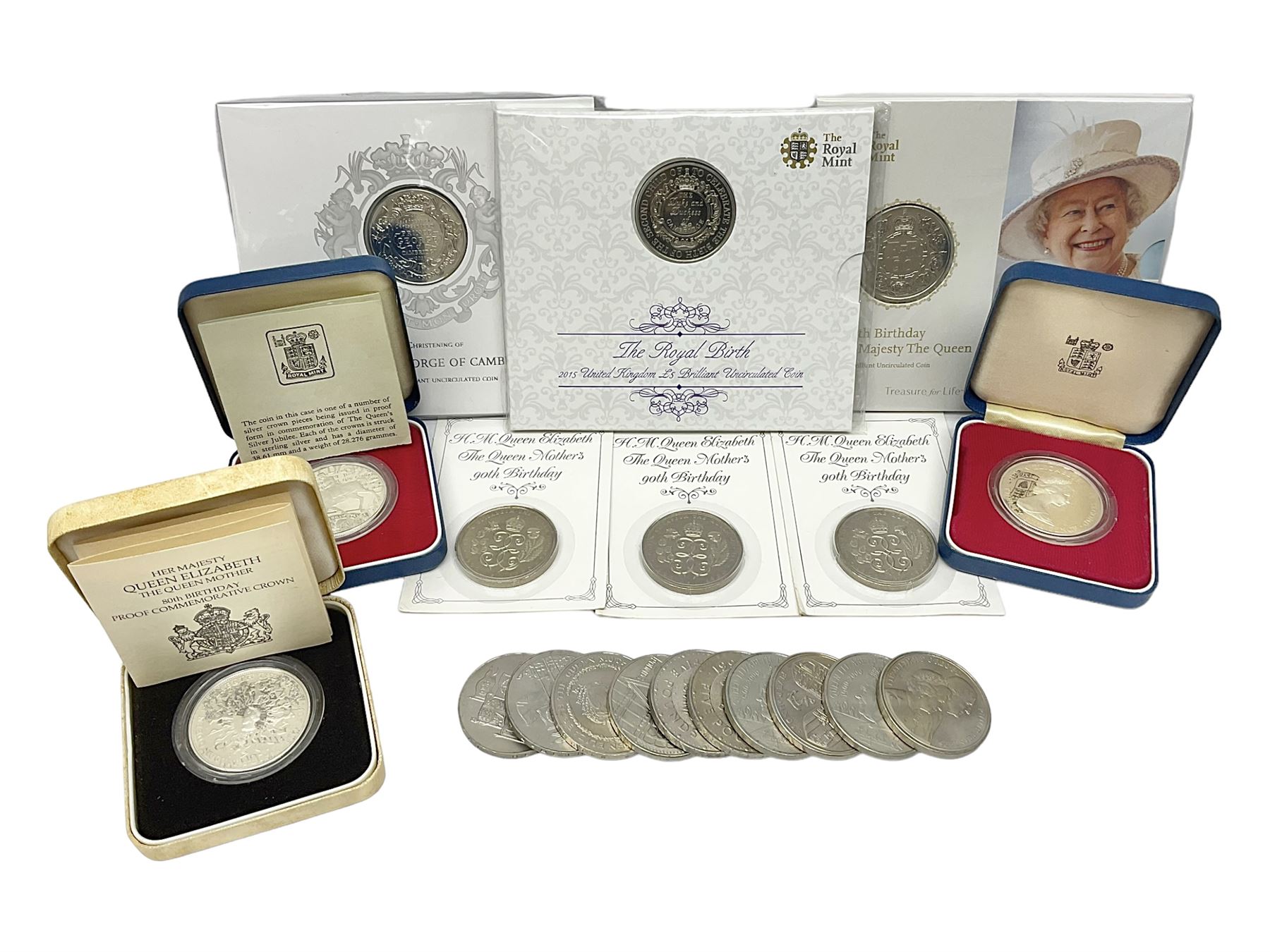 Queen Elizabeth II 1977 silver crown and 1980 silver crown, both cased with certificates, Bailiwick of Guernsey 1978 silver crown cased without certificate, three United Kingdom brilliant uncirculated five pound coins in card folders and twelve other five pound coins