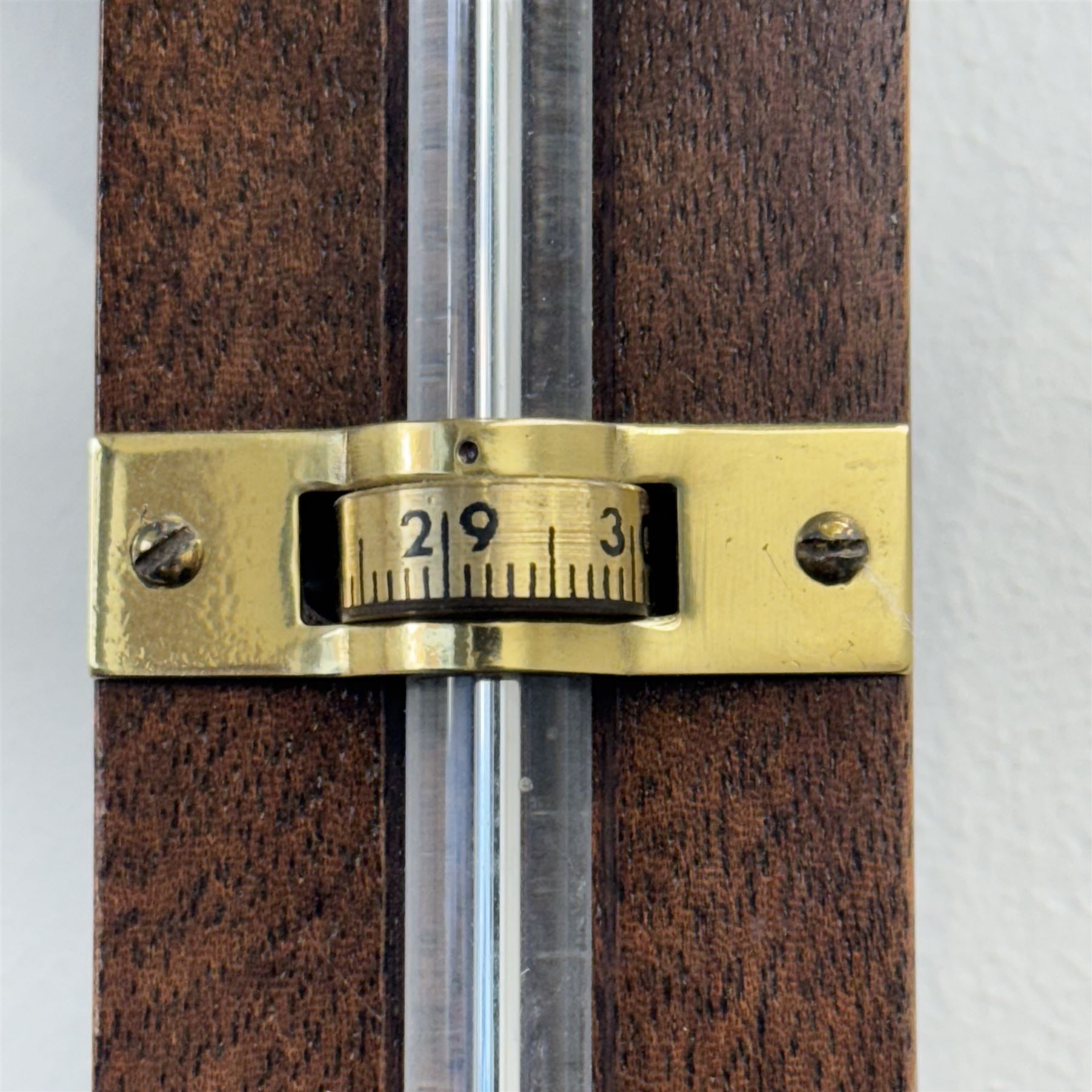 Rapport London -  20th century mercury stick barometer, in a mahogany case with a silver register and an adjustable circular brass recording collar, register indicating barometric air pressure from 27 to 31 inches, with a Fahrenheit spirit thermometer, full length visible cistern tube with a turned wooded cover to the base. 