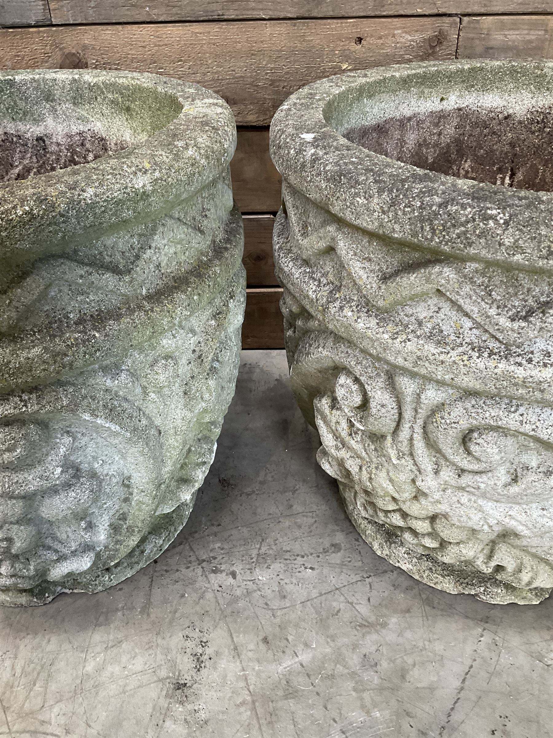 Pair of cast stone ornate circular planters
