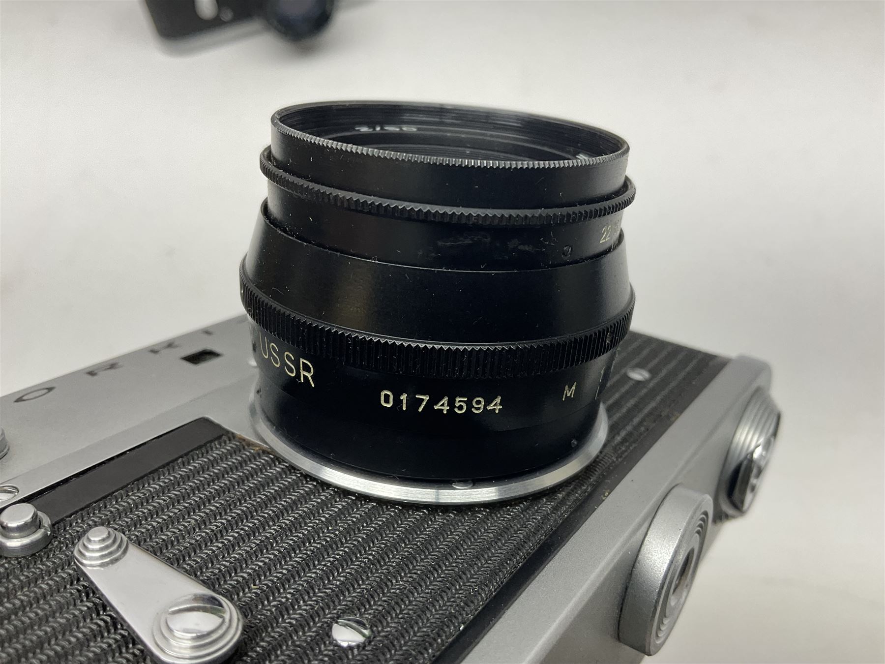 Zorki-4K camera body, serial no 74334713 with 'Jupiter-8 2/50' lens serial no 7454365, Zorki-4 camera body serial no 71012418 with 'Jupiter-8 2/50' lens serial no 0174594, and three other cameras 