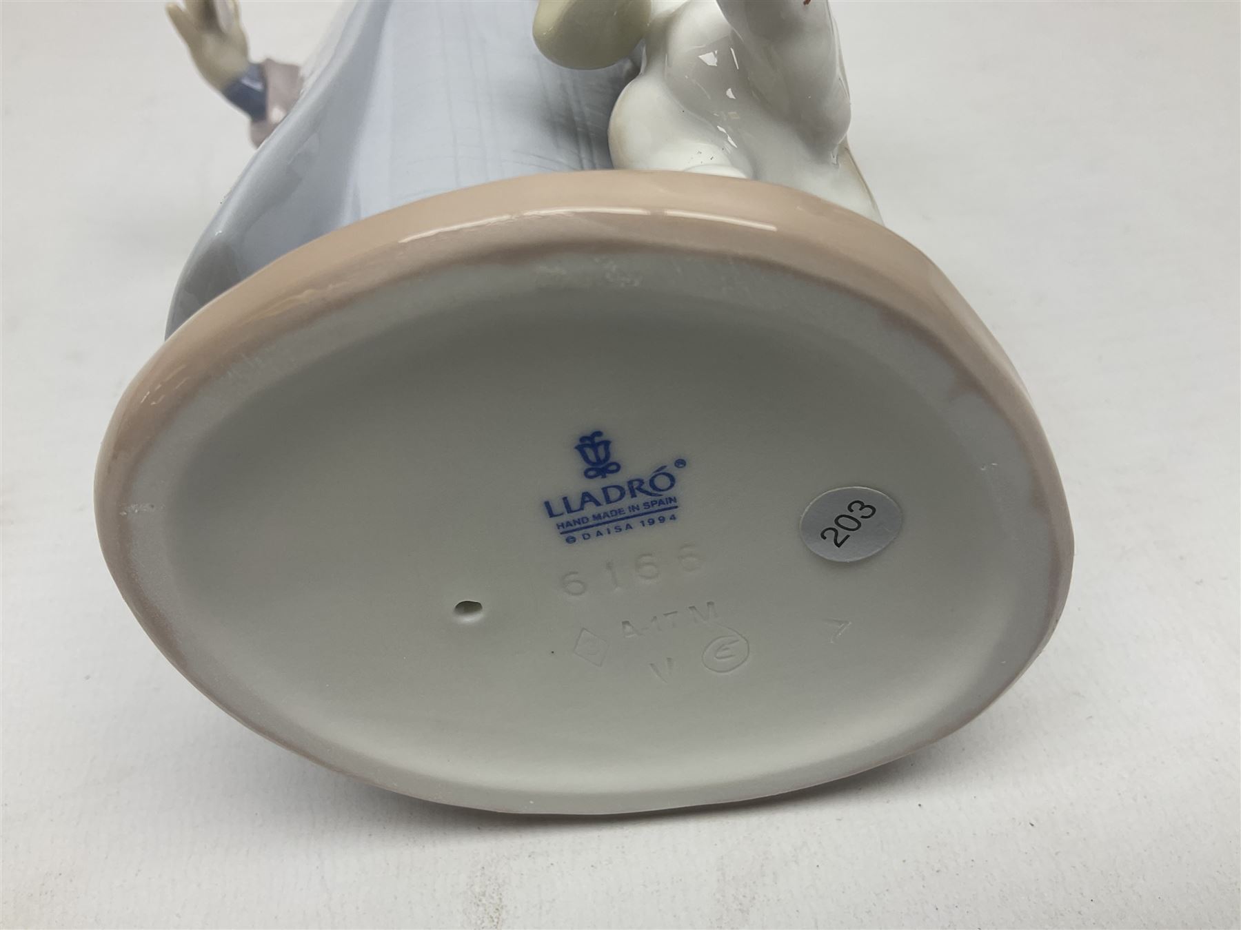 Three Lladro figures, comprising Dear Santa no 6166, Angelic Melody 1993 no 5963 and Seraphs Head no2 no 4885, together with Lladro plaque Love Brings Us Together no 7677, all with original boxes, largest example H18cm