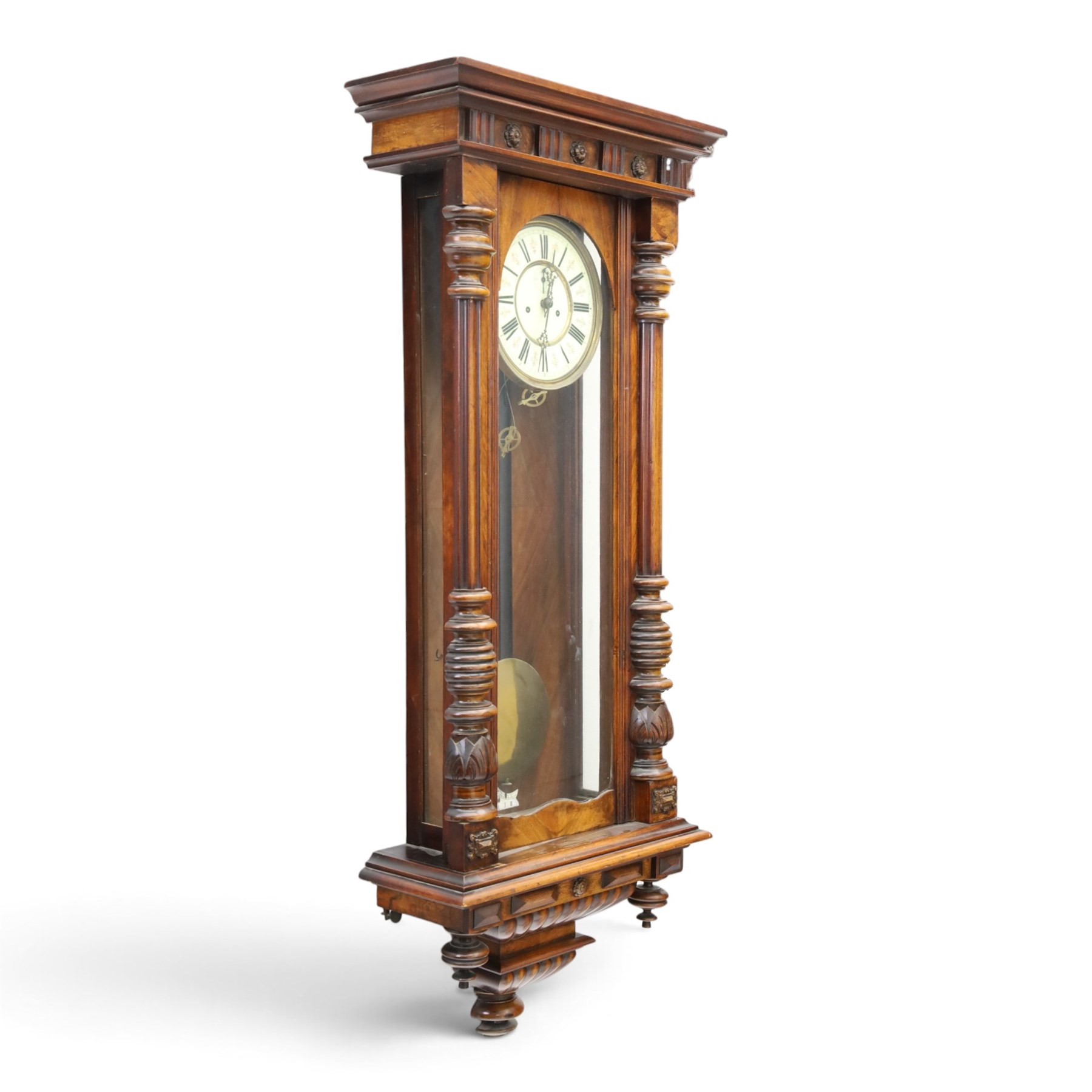19th century mahogany Vienna Regulator wall clock, carved mahogany framed with turned and half-canted pilasters, over a lobed terminal