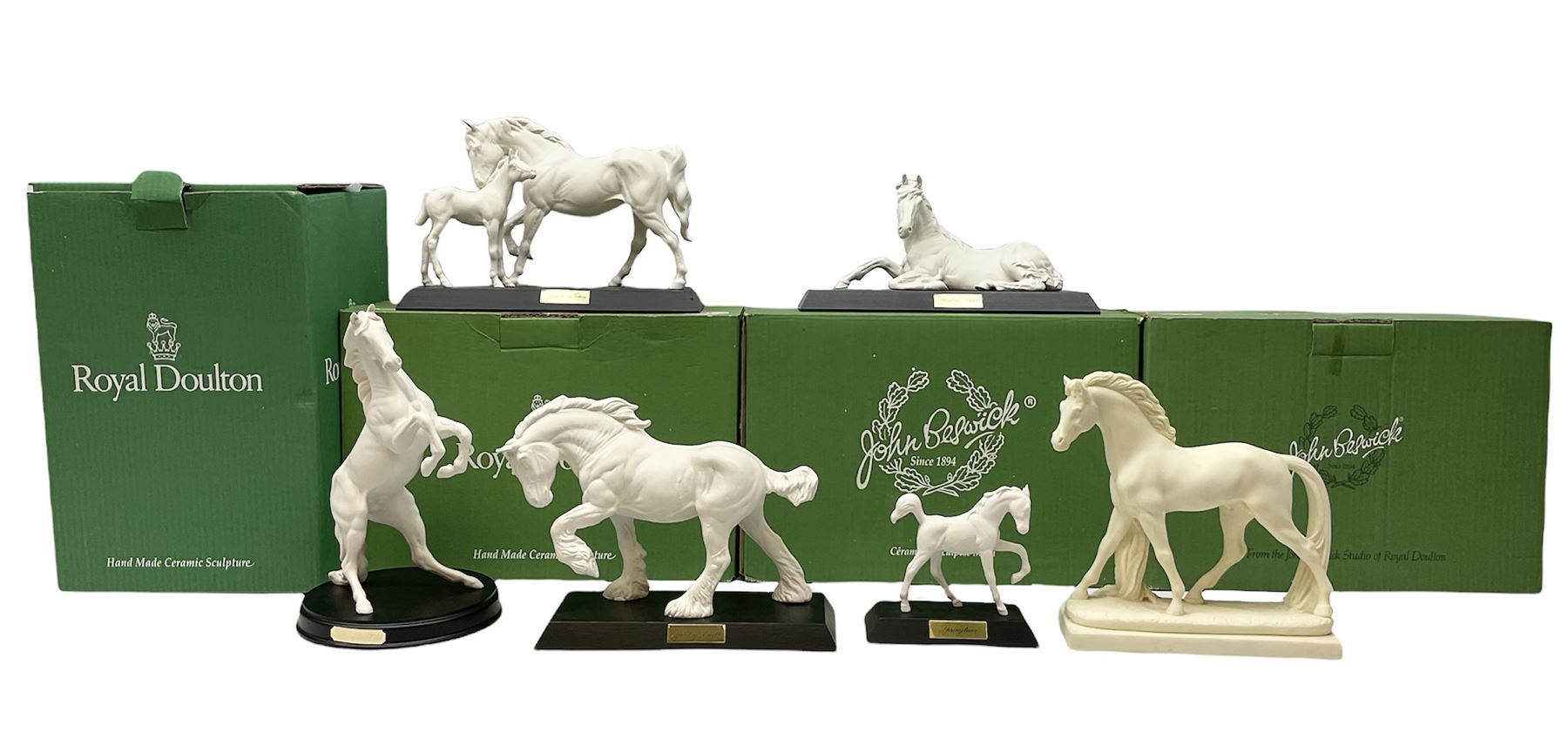 Five Beswick and Royal Doulton horse figures in matt white on black plinths, comprising of  Spirit of Affection no. 2689/2536, Springtime no.2837, Spirit of peace no.2916, Spirit of earth no.2914 and Spirit of the wild no. 183, together with a composite figure of a horse (6)