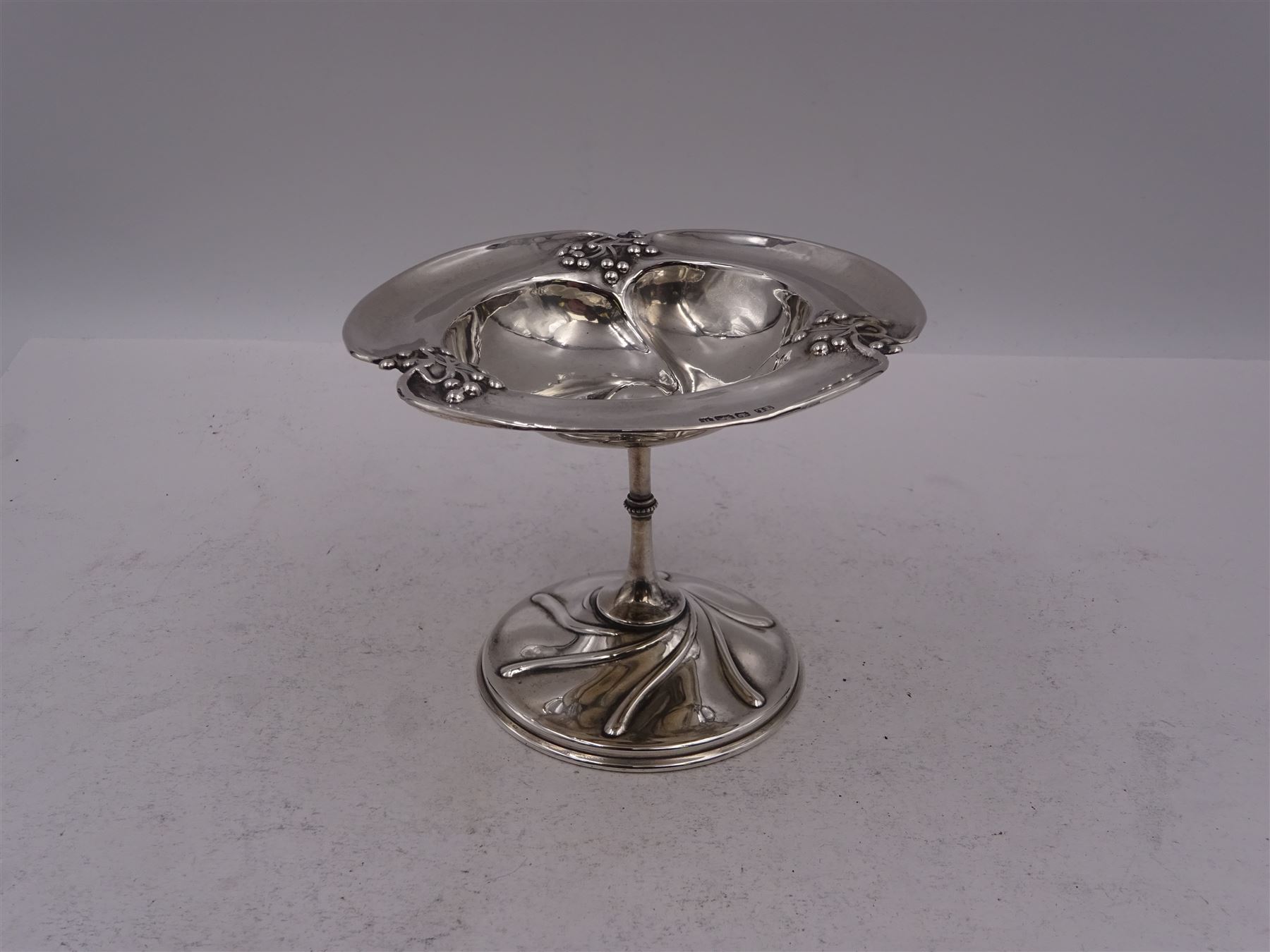 Art Nouveau silver bon bon dish, the bowl of trefoil form embossed with fruiting vines to the rim, upon a knopped pedestal and domed circular foot, hallmarked Levesley Brothers, Sheffield 1905, H8.8cm
