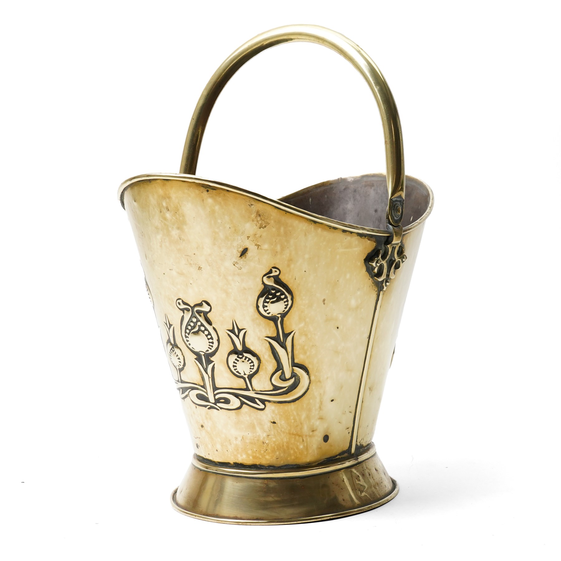 Art Nouveau brass log bucket of oval design with swing handle and a raised pattern of stylised flowers H29cm
