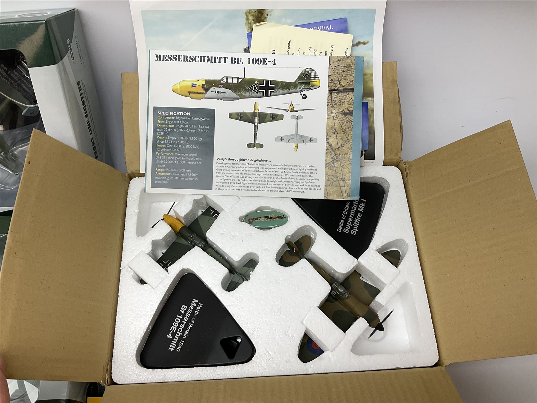 Fourteen die-cast models of aircraft including four Oxford Aviation, two Military Giants of the Sky, two Ixo Models, Corgi Warbirds Messerschmitt, Atlas Editions Spitfire and Messerschmitt, two Hobby Master etc; and two die-cast models of tanks; all boxed (16)