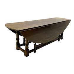 Large 18th century design oak wake or dining table, oval drop-leaf top, turned supports with double gate-leg action base, united by moulded stretchers 