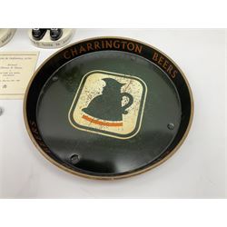 Pair of Royal Doulton Toby Ale Jugs, produced in 1934 for Charrington Ales, together with two circular metal serving trays advertising Charrington brewery, a Charrington badge awarded for 25 years of service and a 1949 menu Fox & Nicholl Ltd annual dinner dance at the toby jug hotel.  