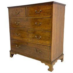 George III oak straight-front chest, fitted with two short over three long graduating drawers, lower moulded edge over shaped bracket feet