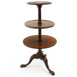 George III mahogany tripod dumb-waiter, three graduating tiers with moulded and lipped edges, on ring turned barrel pedestal supports, on three out-splayed supports 