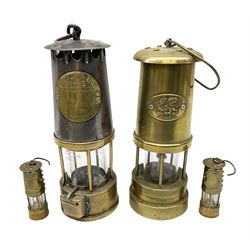 Two brass miners lamps to include an Eccles Manchester Type 6 example, together with two miniature brass lamps stamped Bickershaw Colliery