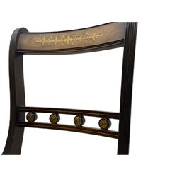 Set of eight Regency style mahogany dining chairs, brass inlay with gilded detail