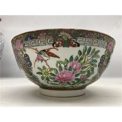 Pair of Chinese famille rose bowls, decorated with reserves of figures in domestic scenes, birds, foliage and flowers, upon a gilt ground, with character marks beneath, D20cm