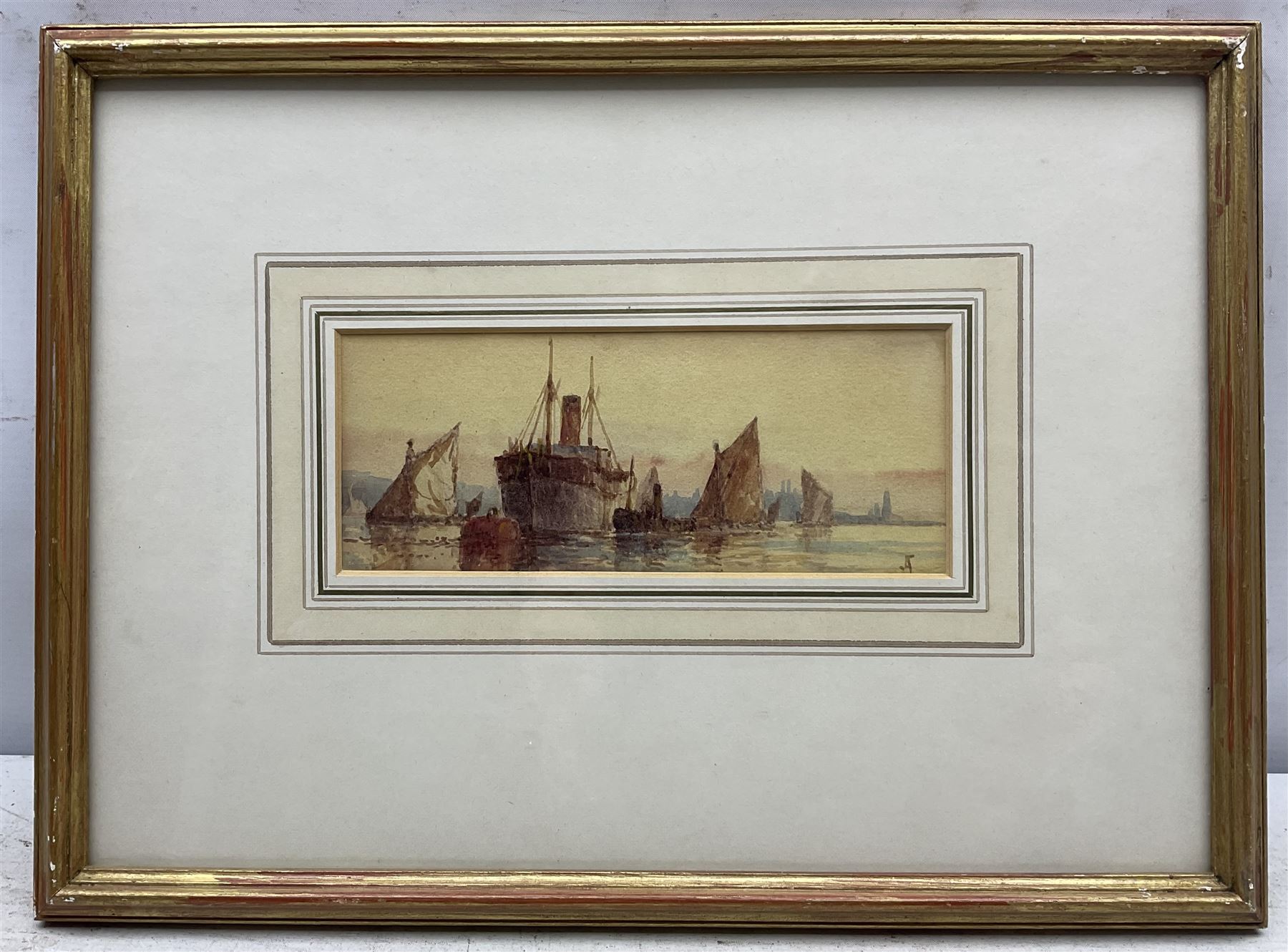 Frederick James Aldridge (British 1850-1933): Ships Moored at Sunset, watercolour signed with monogram 7cm x 17cm