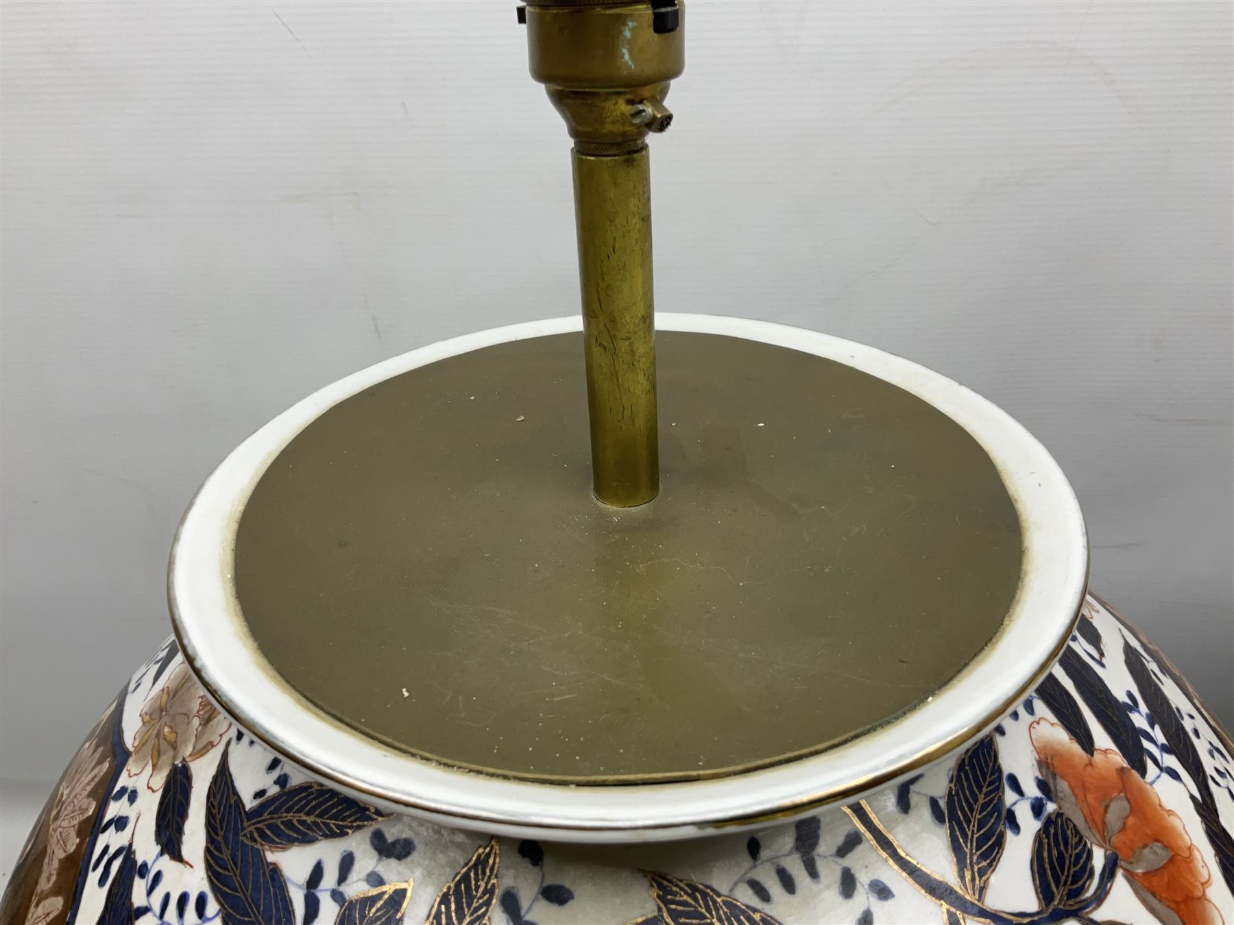 Pair of large and impressive 20th century Japanese Imari table lamps, each of ovoid form, decorated in the Imari palette with roundels containing flowering urns, and shaped panels of birds, set against a white ground decorated with blossoming peonies, lamp base (not including fixtures) H56.5cm overall including shade H89cm