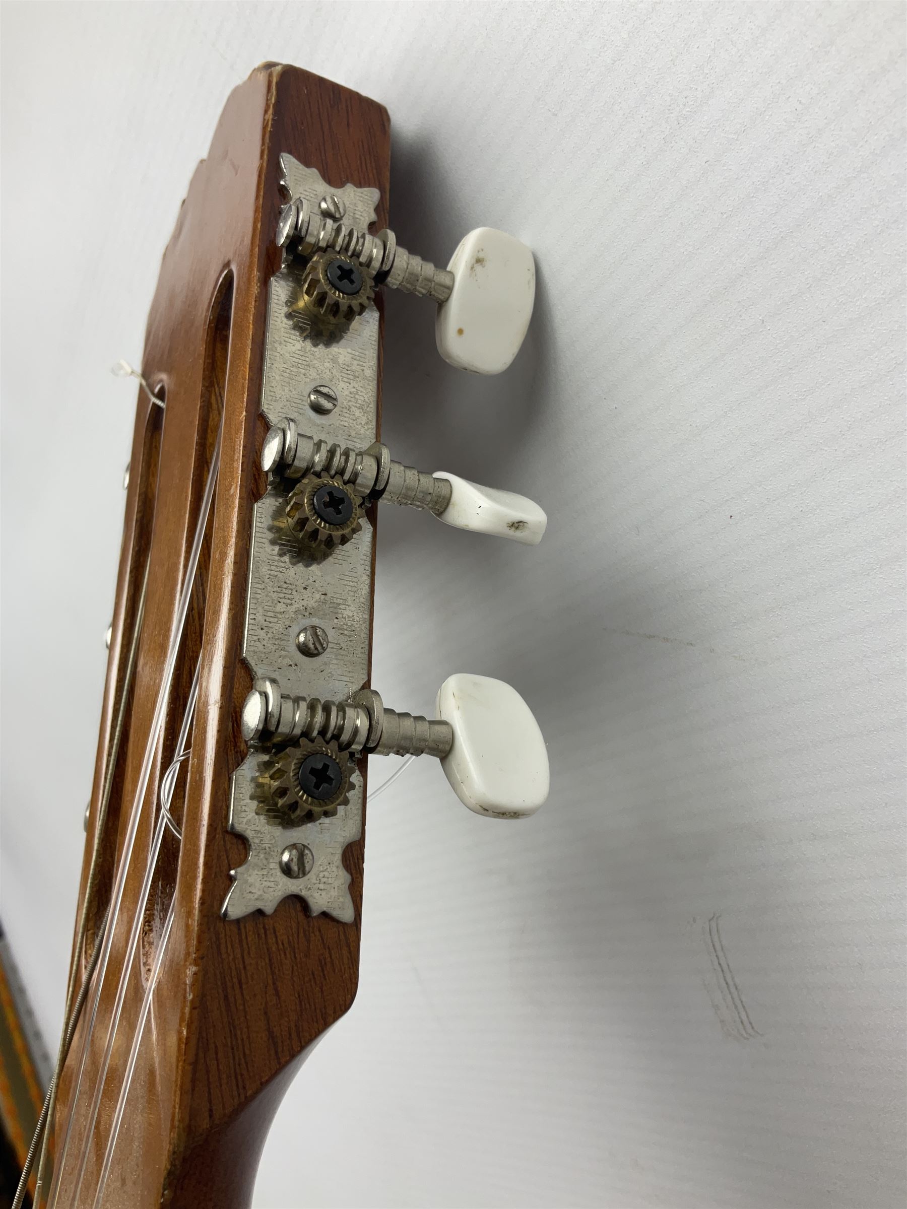 Spanish BM acoustic guitar with mahogany back and sides and spruce top L101cm; in cello carrying case; Roland foot pedal and two Yamaha foot pedals; tin D# organ pipe; folding music stand etc