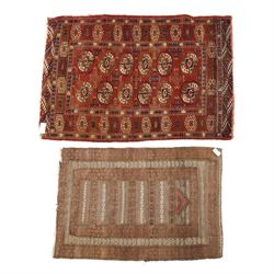 Tekke Turkman rug, madder red field decorated with repeating rows of octagonal guls, frame...