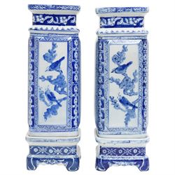 Pair of Chinese blue and white vases and stands, of rectangular form, decorated with panels of birds in nature, H43cm 