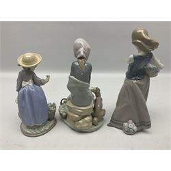 Three Lladro figures, comprising Jealousy no 1278, Hello Flowers no 5543 and Dog on Hip no 1131, all with original boxes, largest example H25cm