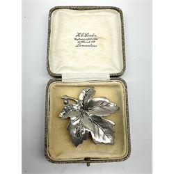 Costume jewellery including brooches, ladies compact, wristwatches, small jewellery box, coins etc