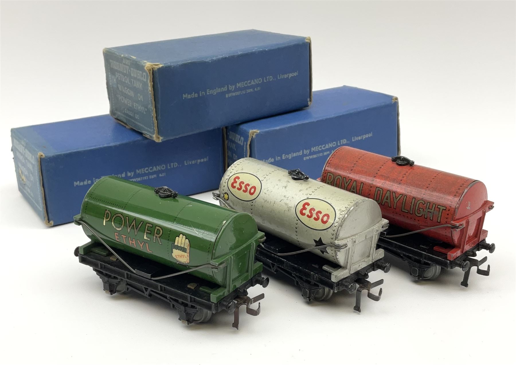 Hornby Dublo - Petrol Tank Wagon D1 'Power Ethyl'; Oil Tank Wagon D1 'Royal Daylight'; and Petrol Tank Wagon D1 'Esso'; all in medium blue boxes (3)