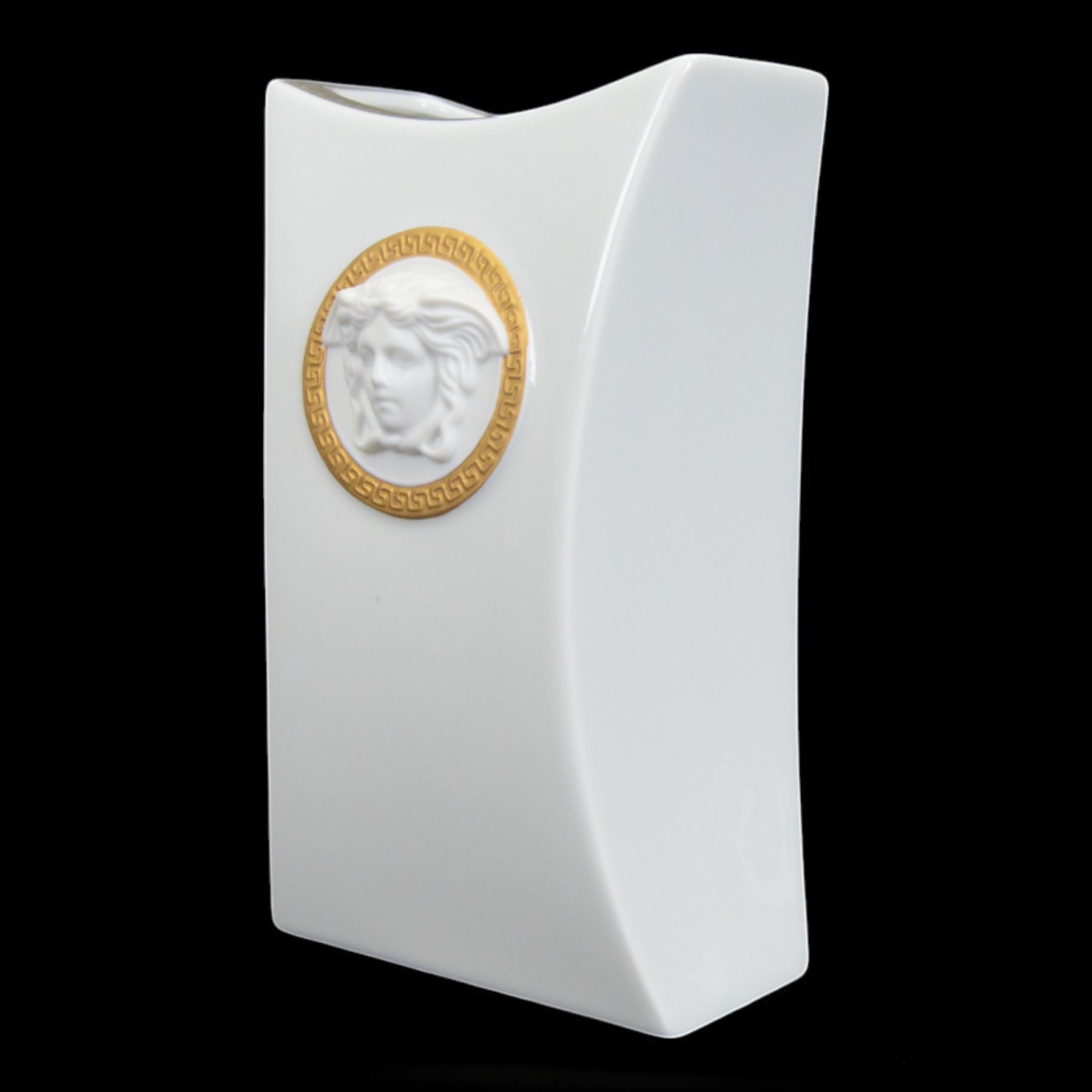 Rosenthal Versace Gorgona vase, of concave form, decorated in relief with medusa masks and gilt greek key borders upon a white ground, boxed, H17cm