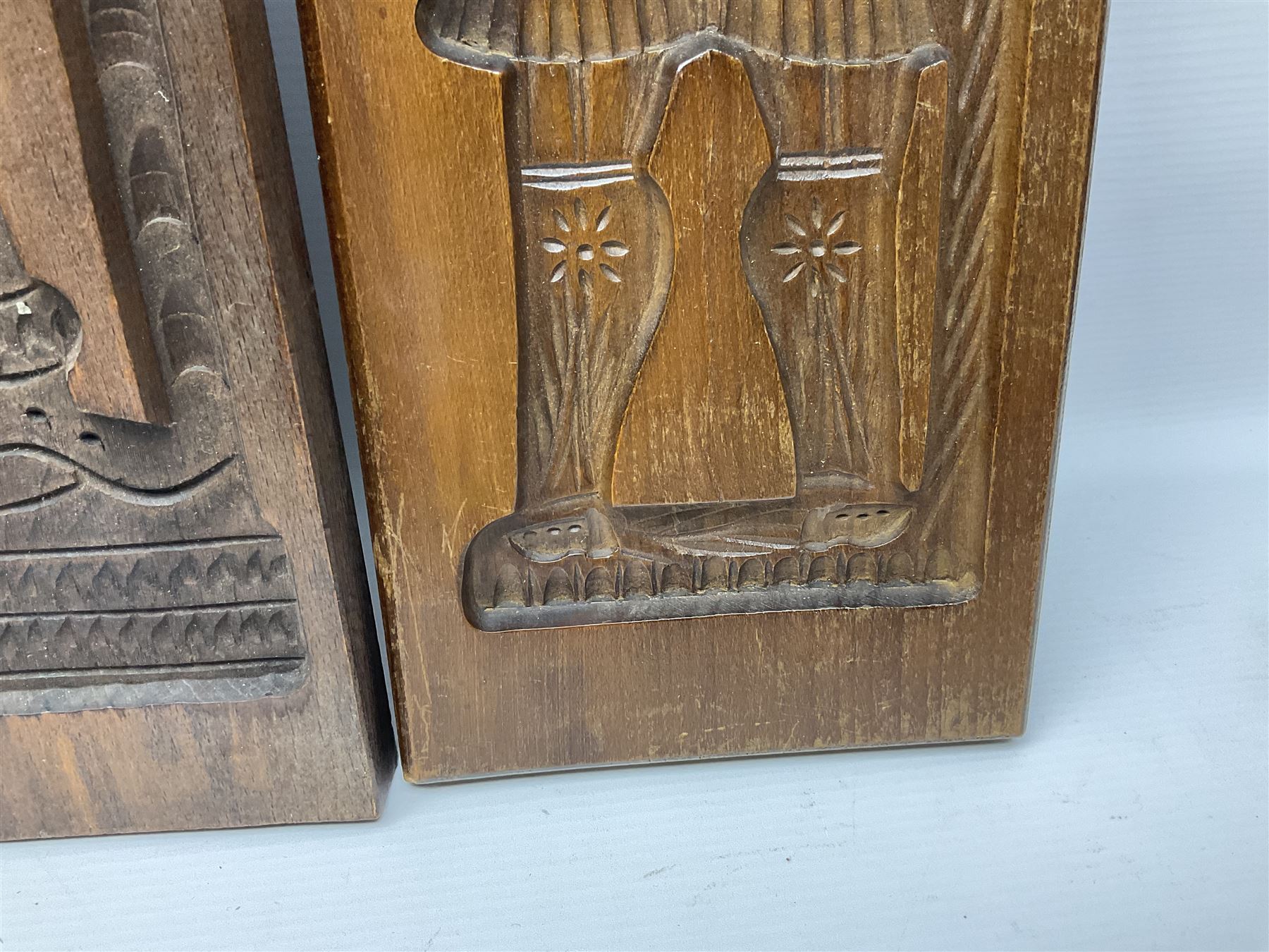 Six 20th century hardwood Dutch folk art Speculaasplank or biscuit moulds, typically carved with figures in traditional dress, largest H101cm