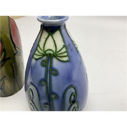 Minton Secessionist vase, with tube-lined stylised flower head decoration on a blue ground, printed mark to base 'Minton Ltd, No. 30', together with another Minton Secessionist tubelined vase,  printed mark to base 'Minton Ltd, No. 16', tallest example H13.5cm