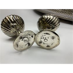 Pair of Mappin and Webb silver plate pierced pedestal bon bon dishes, together with other silver plate comprising teapot stand engraved with lion's head to centre, two cut glass claret jugs, two bottle coasters with acorn decoration, two open salts upon dolphin mounts, tea caddy, three piece cruet set and a large oval tray with pierced sides and upon four ball feet