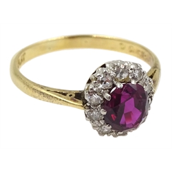 Gold oval ruby and diamond cluster ring, stamped 18ct & Plat