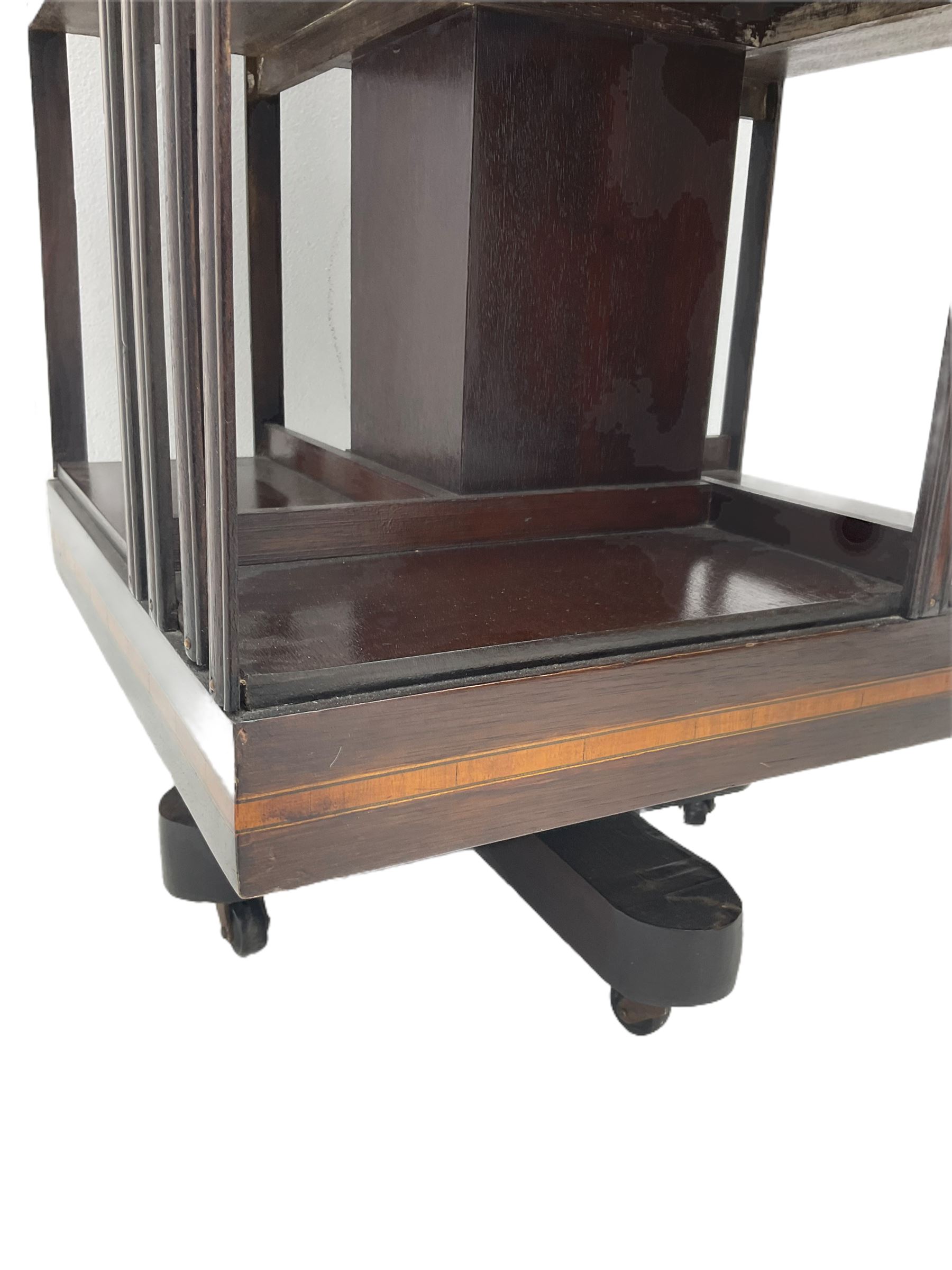 20th century mahogany revolving bookcase, inlaid centre motif, satinwood banded border