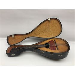 Late 19th century Italian lute back mandolin with segmented bowl back, bears label Gennaro Maglioni Napoli L61cm; in ebonised wooden case; together with another similar damaged Italian lute back mandolin for restoration or spares (2)