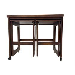 Mid-20th century teak nest of tables, with fold-over top