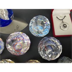 Swarovski Crystal paperweights, to include a globe with dove to the top, pyramid shapes etc, together with a large collection of boxes and stands  
