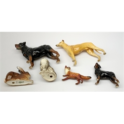 A group of Beswick figures, comprising a Rottweiler, and Rottweiler puppy, Grey Hound marked CH Jovial Roger, grey kitten marked 1886, fox, and a Royal Doulton figure of a Rabbit, HN2592. 