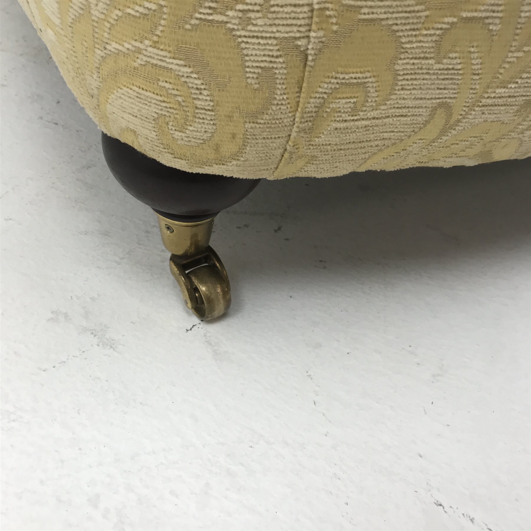 Licoln House wing back armchair, upholstered in a pale gold chenille fabric with floral pattern, shaped back, scrolled arms on turned supports, W91cm